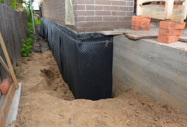 Happy homeowners after waterproofing job in Partlow